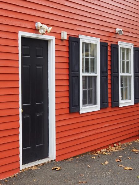 Red Vinyl Siding Installation in Brick