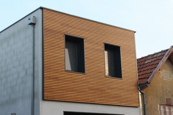 Treated Wood Siding Repair in Brick