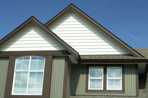 Vertical Vinyl Siding Repair in Brick