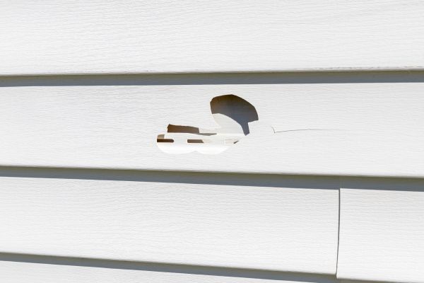 White Vinyl Siding Repair in Brick
