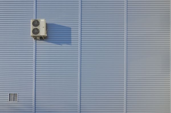 Flat Metal Siding Installation in Brick